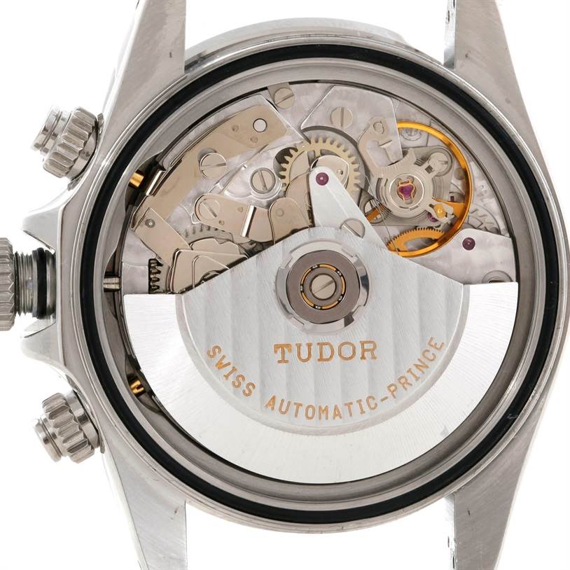 The image shows an exposed back view of the Tudor Tiger 79260 Men's Stainless Steel Silver Dial 79260 Men's Stainless Steel Silver Dial model watch, revealing its internal mechanical movements.