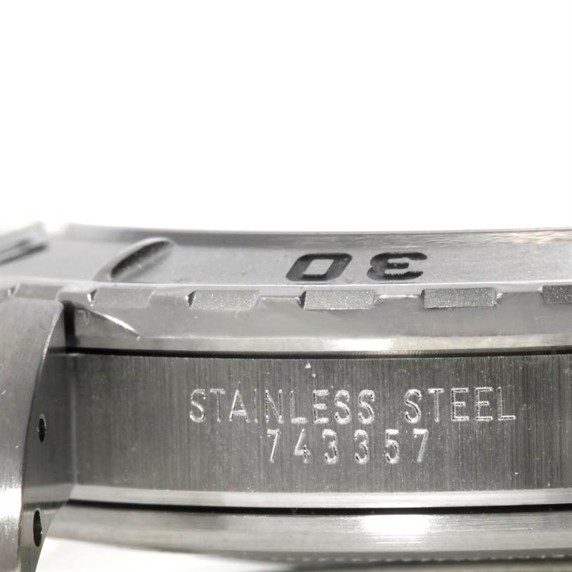 This image shows a close-up of the bezel and side casing of the Tudor Hydronaut 89190 Men's Stainless Steel Silver Dial 89190 Men's Stainless Steel Silver Dial watch, highlighting its stainless steel material and serial number.