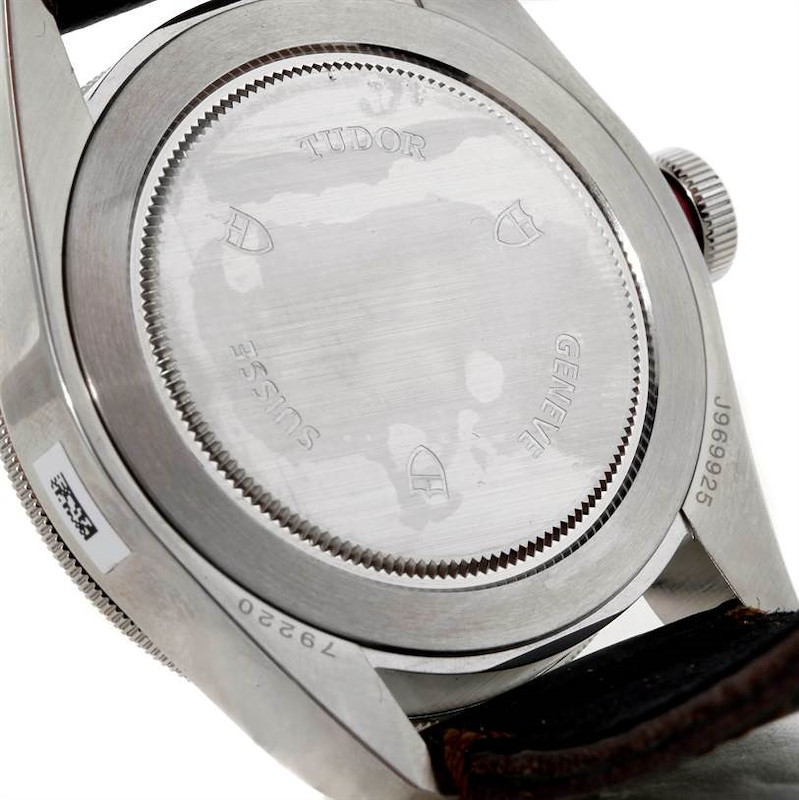 This image shows the back case of the Tudor Heritage Black Bay watch, with brand engravings visible, including "TUDOR," "GENEVE," and "SWISS."