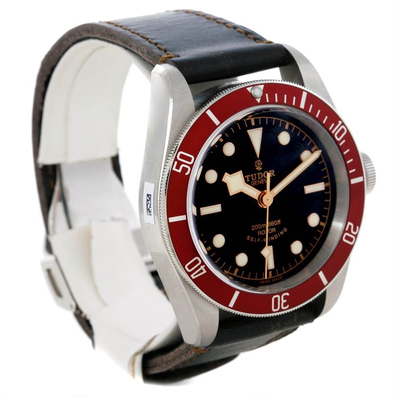 This Tudor Heritage Black Bay 79220R Men
s Stainless Steel Black Dial 79220R Men
s Stainless Steel Black Dial watch is shown from an angled side view, displaying the watch face, bezel, and leather strap.
