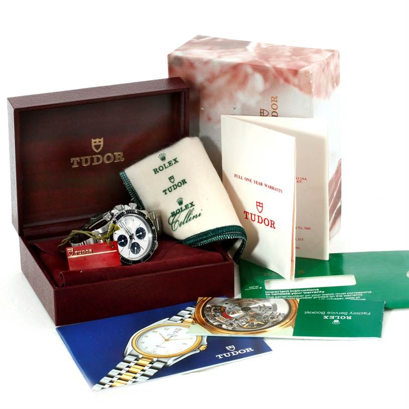 The image shows the Tudor Big Block 79170 Men's Stainless Steel Silver Dial 79170 Men's Stainless Steel Silver Dial watch and its accessories, including the box, manuals, warranty card, and cloth.