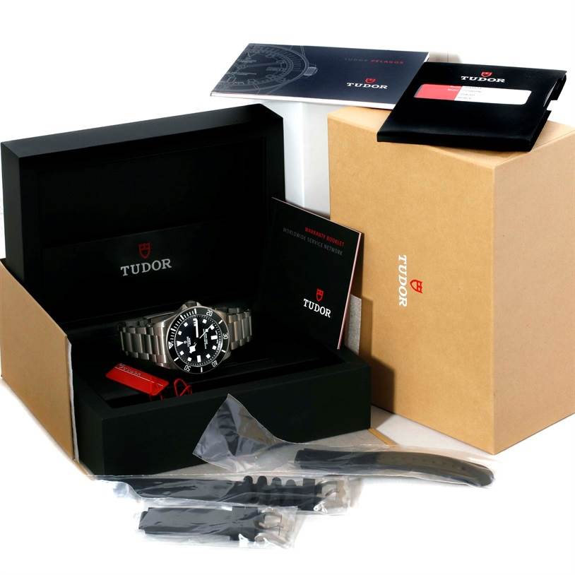 The image shows a Tudor Pelagos 25500TN Men's Titanium Black Dial 25500TN Men's Titanium Black Dial watch with its box, manuals, warranty card, extra straps, and packaging.