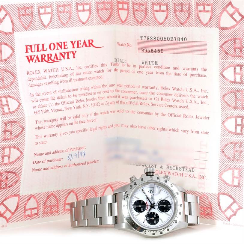The image shows the Tudor Tiger 79280 Men's Stainless Steel White Dial 79280 Men's Stainless Steel White Dial model watch face and bracelet, displayed against its warranty card.
