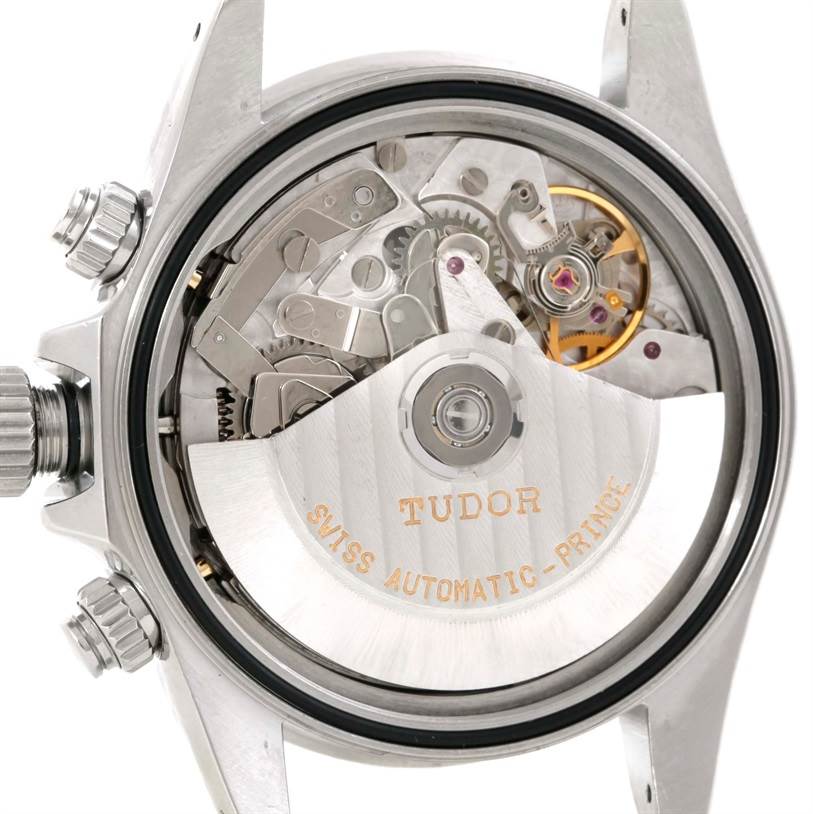 The image shows the back view of a Tudor Tiger 79280 Men's Stainless Steel White Dial 79280 Men's Stainless Steel White Dial model watch, highlighting its automatic movement and mechanical components.