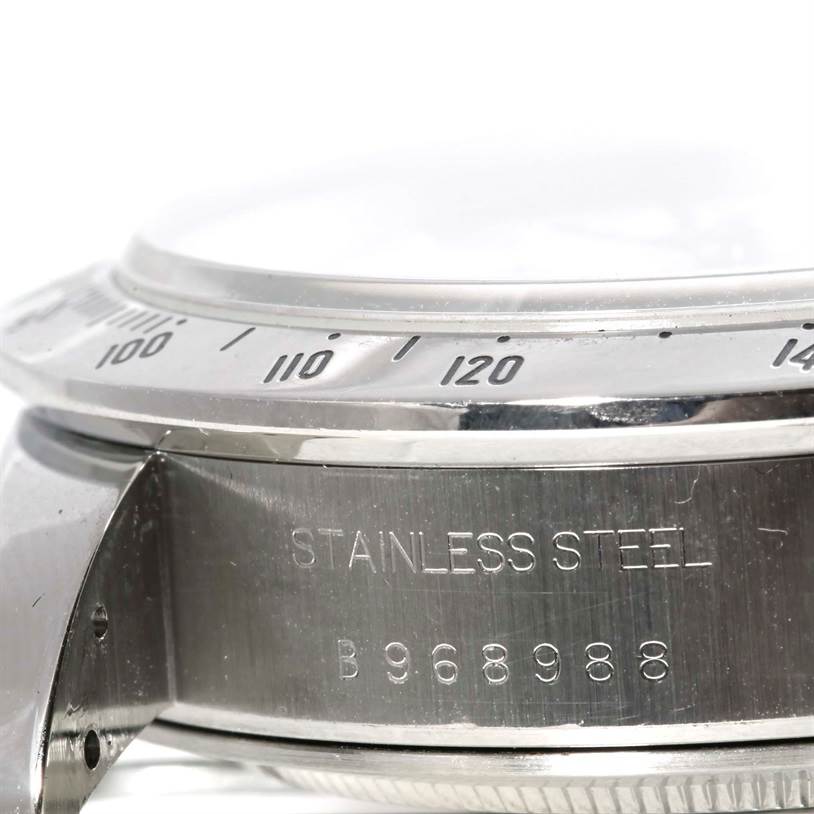 The image shows a side angle of the Tudor Tiger 79280 Men's Stainless Steel White Dial 79280 Men's Stainless Steel White Dial model watch, highlighting the bezel, case, and engraved serial number.