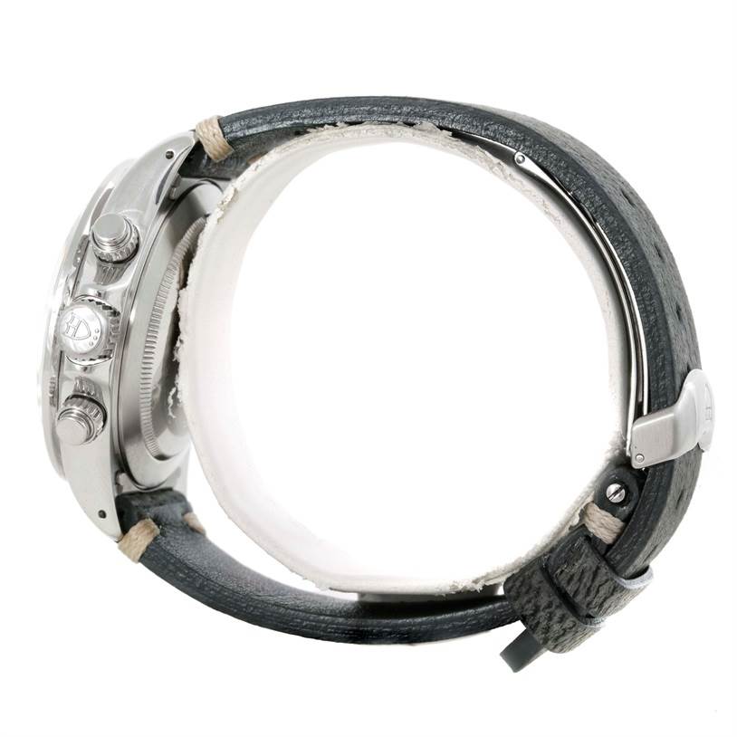 This side view of the Tudor Tiger 79280 Men's Stainless Steel White Dial 79280 Men's Stainless Steel White Dial model watch shows the crown, pushers, and partially the leather strap.