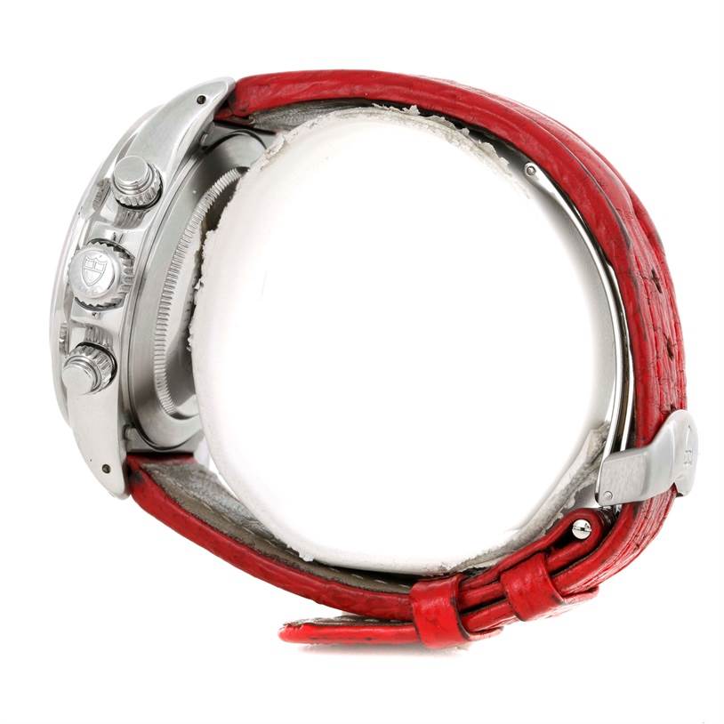 This is a side view of a Tudor Prince watch, showing the crown, pushers, and red strap with buckle.