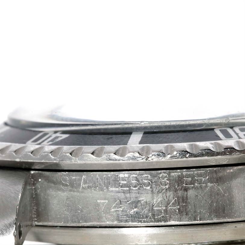 The image shows a close-up side angle of a Tudor Submariner 7016 Men's Stainless Steel Black Dial 7016 Men's Stainless Steel Black Dial, focusing on the bezel and part of the stainless steel case.