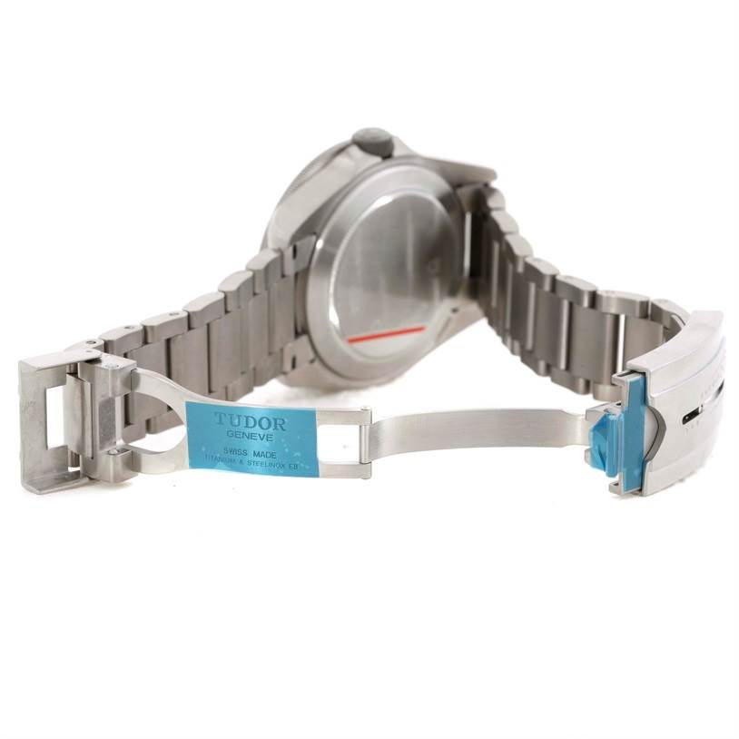 The image shows a Tudor Pelagos 25500TN Men's Titanium Black Dial 25500TN Men's Titanium Black Dial watch from the back, focusing on the open clasp and bracelet.