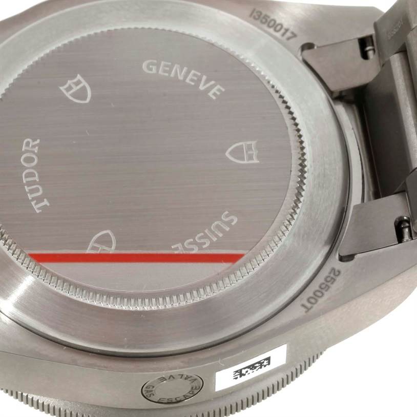 This image shows the back casing of the Tudor Pelagos 25500TN Men's Titanium Black Dial 25500TN Men's Titanium Black Dial watch, showcasing its brand engravings and metal texture.