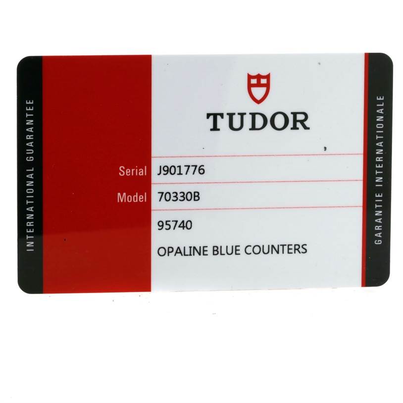This image shows the guarantee card for the Tudor Heritage Chrono 70330 Men's Stainless Steel Blue Dial 70330 Men's Stainless Steel Blue Dial watch, model 70330B with opaline blue counters.