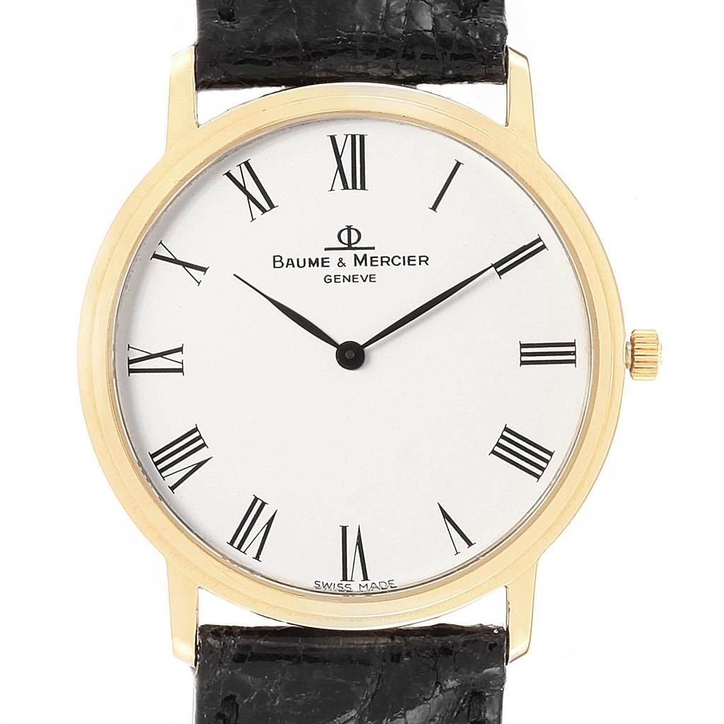 The image shows a front angle of the Baume & Mercier Classima 95612 Men's Yellow Gold White Dial 95612 Men's Yellow Gold White Dial watch, highlighting its dial, Roman numerals, case, and crown.