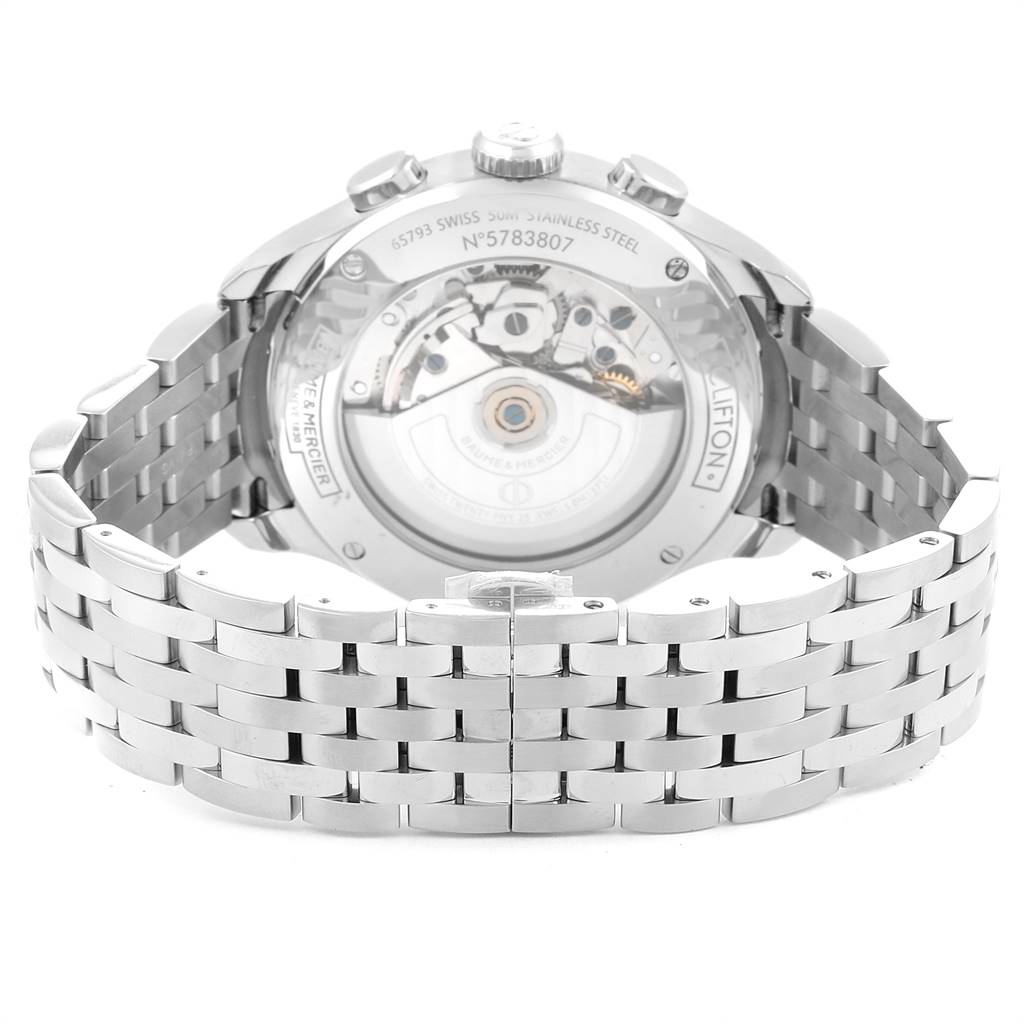 The image shows the back angle of a Baume & Mercier Classima M0A10279 Men's Stainless Steel Silver Dial M0A10279 Men's Stainless Steel Silver Dial watch, highlighting the stainless steel bracelet and transparent case back.