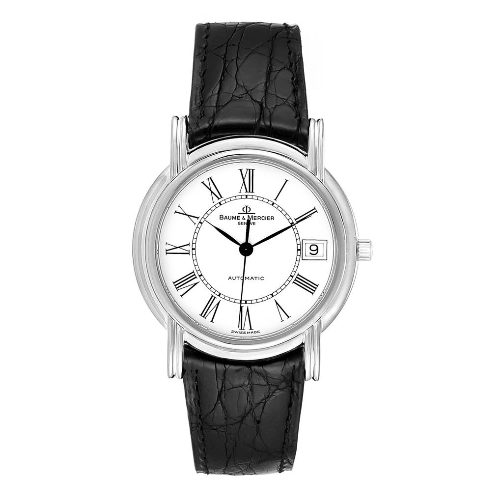 The Baume & Mercier Classima MOA06167 Men's White Gold White Dial MOA06167 Men's White Gold White Dial watch is shown from a front angle, displaying its round dial, black leather strap, and Roman numerals.
