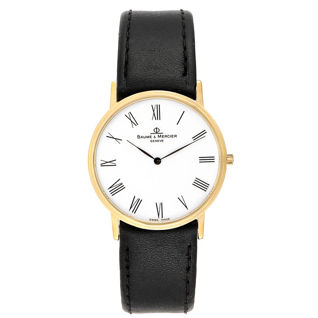 The image shows a front view of a Baume & Mercier Classima MV045088 Men's Yellow Gold White Dial MV045088 Men's Yellow Gold White Dial watch, featuring a white dial, black Roman numerals, gold case, and black leather strap.