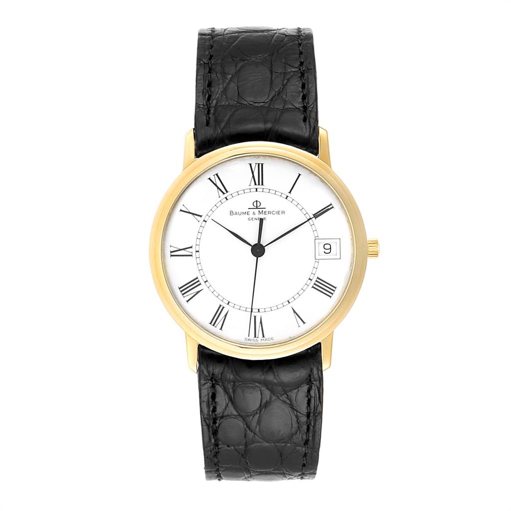 The Baume & Mercier Classima MV045077 Men's Yellow Gold White Dial MV045077 Men's Yellow Gold White Dial watch is shown from a top-down angle, displaying the face, case, and black leather strap.
