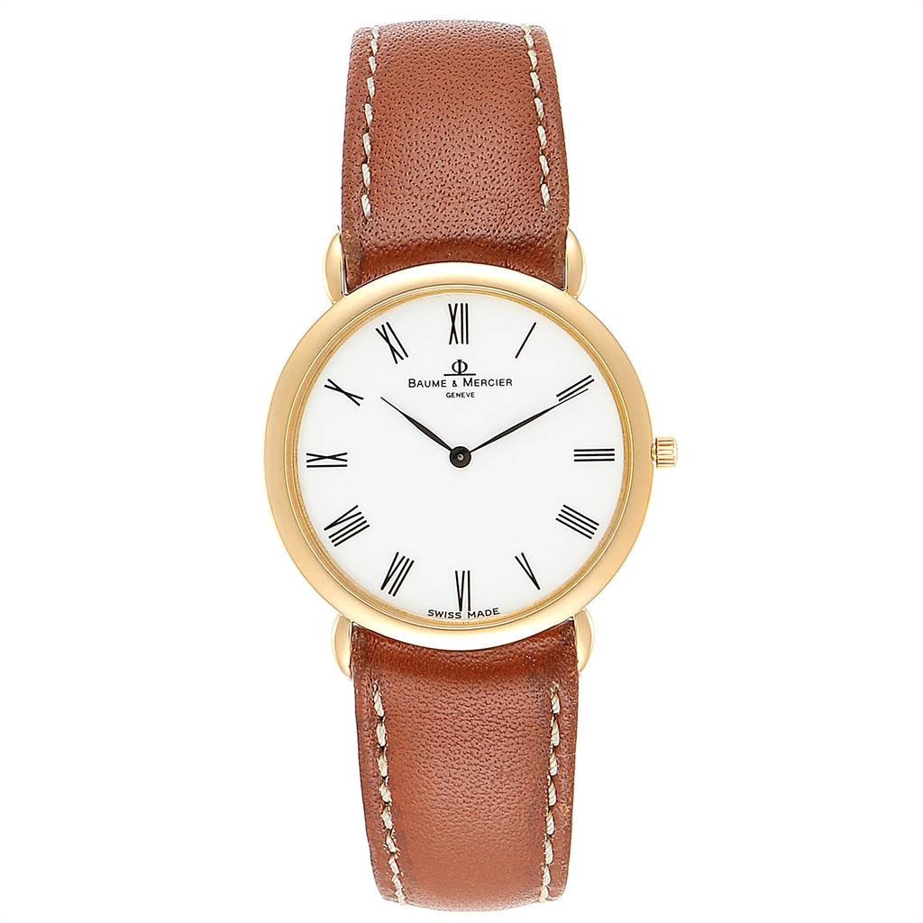 The Classima model by Baume & Mercier is shown from a top-down angle, highlighting the watch face and brown leather strap.