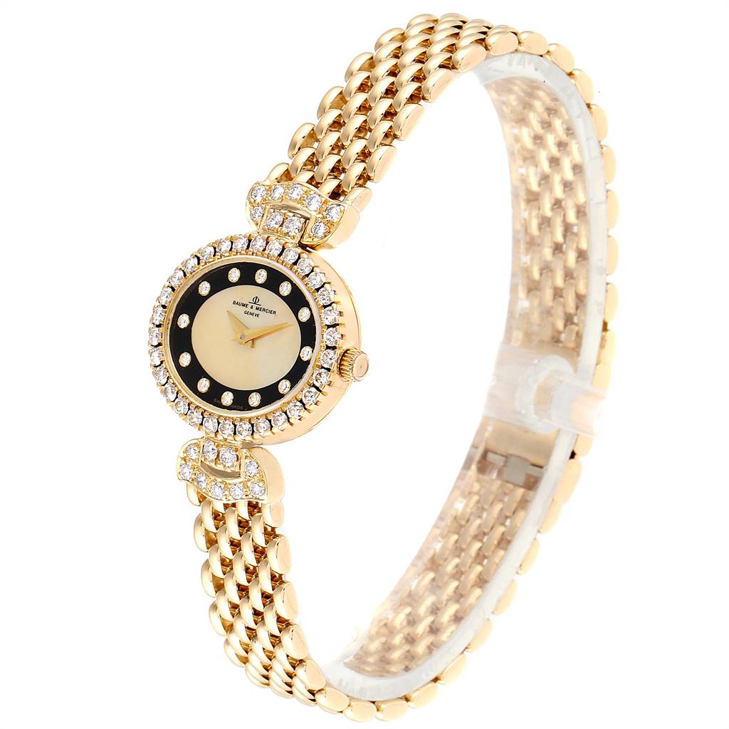 The image shows a Baume & Mercier 18523/9 Women's Yellow Gold Mother of Pearl Dial 18523/9 Women's Yellow Gold Mother of Pearl Dial Yellow Gold MOP Diamond Vintage Cocktail Ladies Watch model 18523, angled roughly 45 degrees to showcase its face and band.