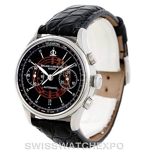 The Baume & Mercier Classima Men's Stainless Steel Black Dial Men's Stainless Steel Black Dial watch is shown from a three-quarter front angle, highlighting its black dial, chronograph features, and leather strap.