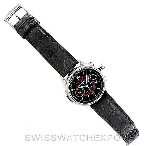 The image shows a Baume & Mercier Classima Men's Stainless Steel Black Dial Men's Stainless Steel Black Dial watch at a diagonal angle, displaying the dial and the black leather strap.