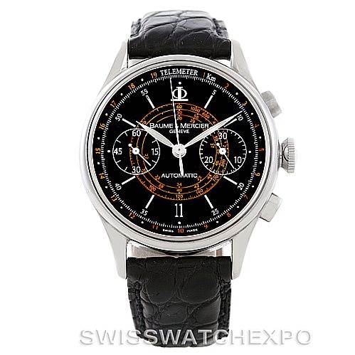 The image shows a front view of the Baume & Mercier Classima Men's Stainless Steel Black Dial Men's Stainless Steel Black Dial watch, highlighting its black dial, leather strap, and chronograph features.