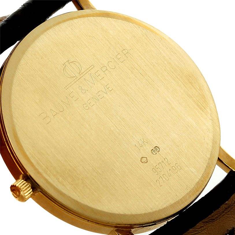 The image shows the back case of a Baume & Mercier Classima 95712 Men's Yellow Gold White Dial 95712 Men's Yellow Gold White Dial watch, highlighting the brand engraving and model details.