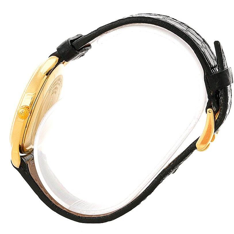 This image shows a side profile view of the Baume & Mercier Classima 8160 Men's Yellow Gold White Dial 8160 Men's Yellow Gold White Dial watch, featuring a gold case and black leather strap.