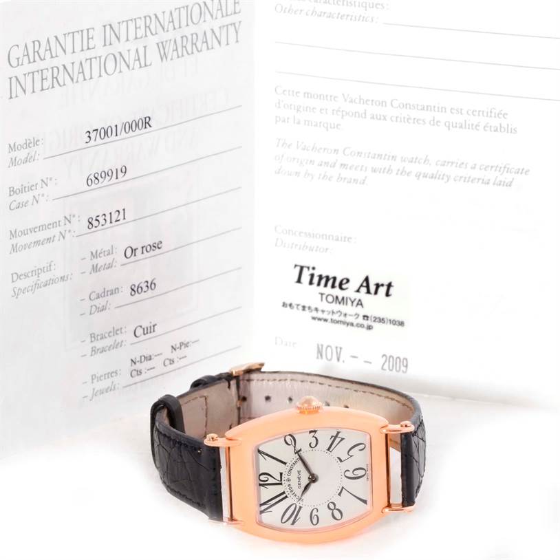 The image shows a Vacheron Constantin Historiques 37001 Men's Rose Gold Silver Dial 37001 Men's Rose Gold Silver Dial model watch with a rose gold case and black leather strap, angled front-side up, alongside its warranty card.