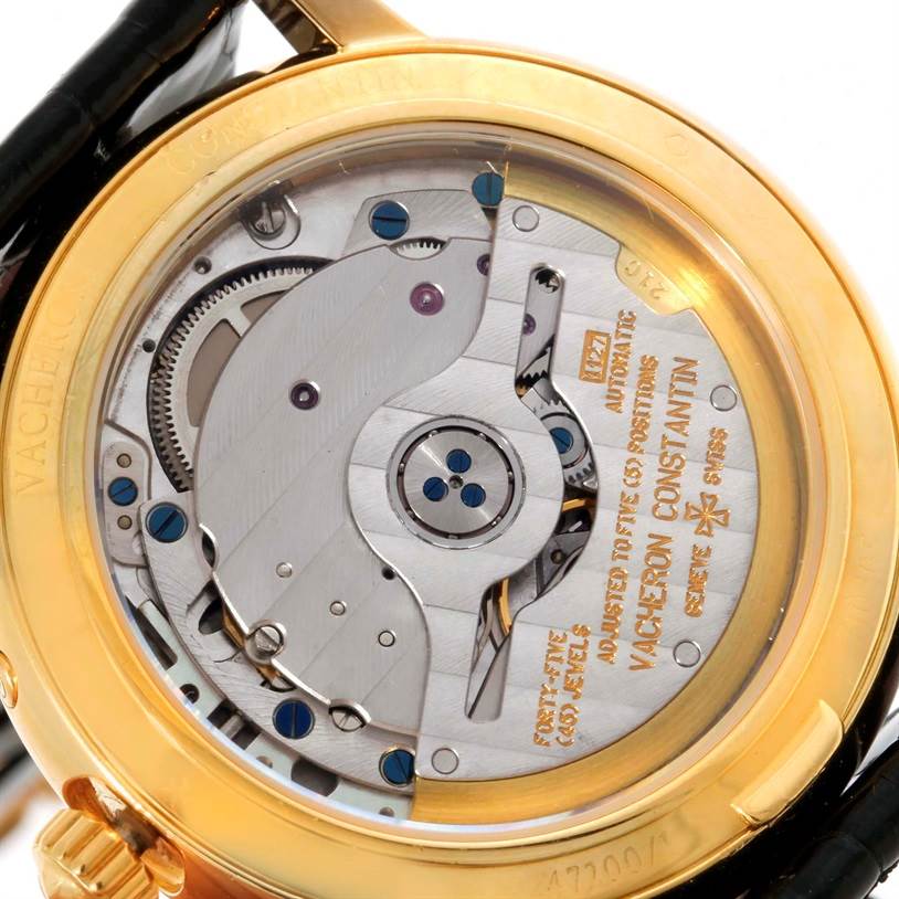 The image shows the back view of a Vacheron Constantin Patrimony 47200/1 Men's Yellow Gold Silver Dial 47200/1 Men's Yellow Gold Silver Dial watch, highlighting its intricate mechanical movement.