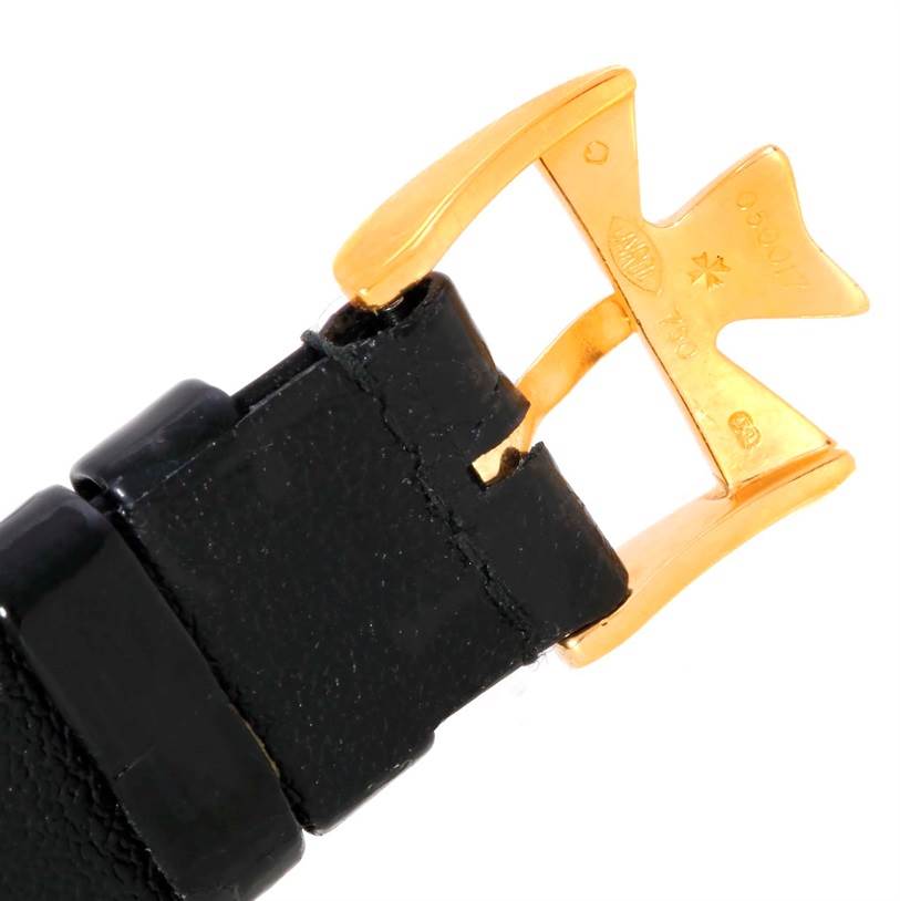 This image shows a close-up angle of the buckle on the black leather strap of the Patrimony model by Vacheron Constantin.