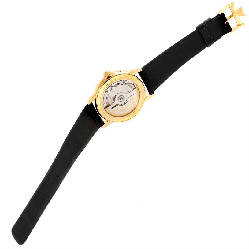 The image shows the back view of a Vacheron Constantin Patrimony 47200/1 Men's Yellow Gold Silver Dial 47200/1 Men's Yellow Gold Silver Dial watch, revealing its movement and black leather strap.