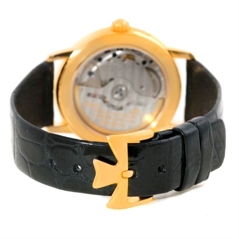 The image shows the back view of the Vacheron Constantin Patrimony 47200/1 Men's Yellow Gold Silver Dial 47200/1 Men's Yellow Gold Silver Dial watch, highlighting its transparent case back and black leather strap.