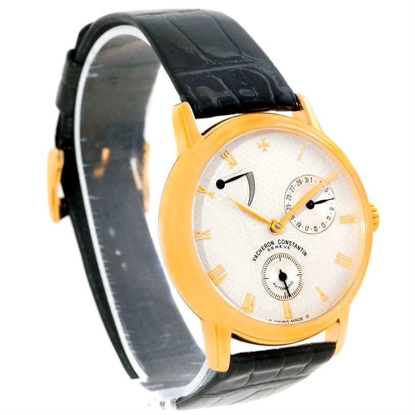 This Vacheron Constantin Patrimony 47200/1 Men's Yellow Gold Silver Dial 47200/1 Men's Yellow Gold Silver Dial model is shown at a slight angle, displaying its gold case, dial, and black leather strap.