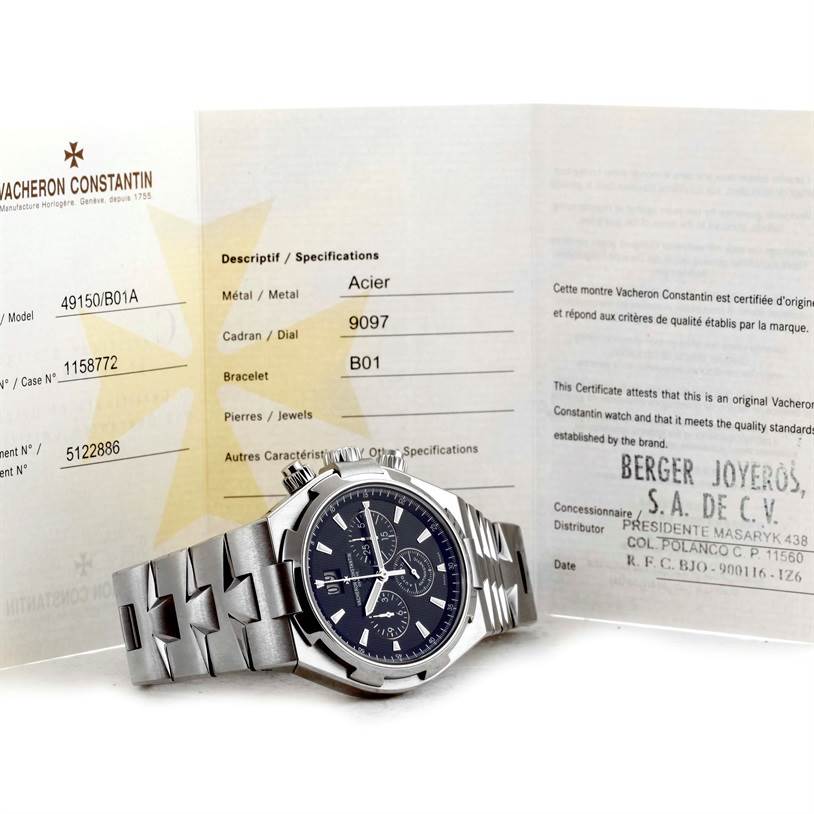 The image shows a Vacheron Constantin Overseas 49150.B01A.9097 Men's Stainless Steel Black Dial 49150.B01A.9097 Men's Stainless Steel Black Dial watch laid flat in front of its certification documents.