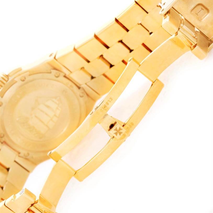 The image shows the clasp and partially opened bracelet of the Vacheron Constantin Overseas 42050/423J Men's Yellow Gold Silver Dial 42050/423J Men's Yellow Gold Silver Dial watch.