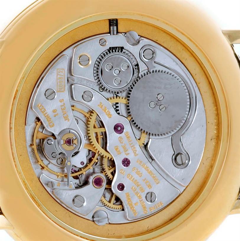 This image shows the intricate internal mechanics of a Vintage Vacheron Constantin watch from a close-up, rear perspective.