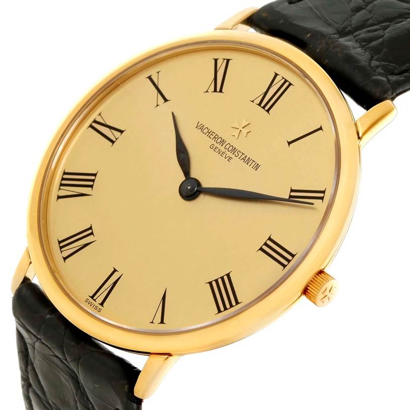 The image shows a Vacheron Constantin Vintage 33160 Yellow Gold Champagne Dial 33160 Yellow Gold Champagne Dial watch at a slight angle, highlighting the gold case, Roman numeral dial, and black leather strap.