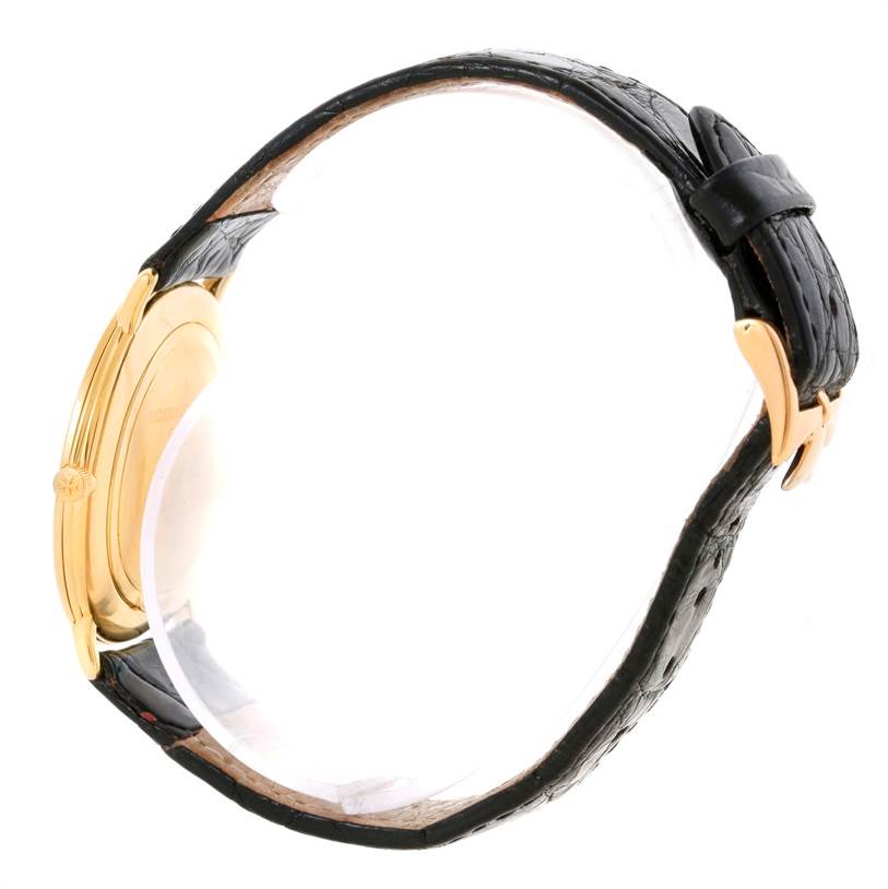 The image shows a side view of a Vacheron Constantin Vintage 33160 Yellow Gold Champagne Dial 33160 Yellow Gold Champagne Dial model, highlighting the watch case, crown, and leather strap with buckle.