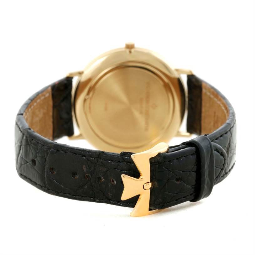 This image shows the back view of a Vintage Vacheron Constantin watch, highlighting the case back and leather strap with a unique buckle.