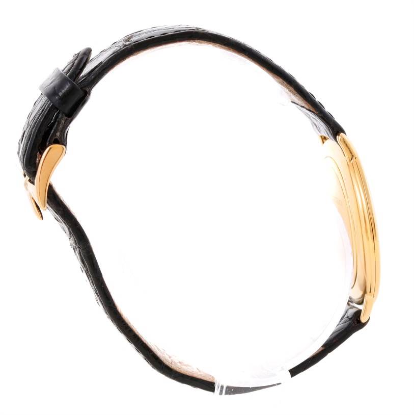 The image shows a side view of the vintage Vacheron Constantin watch, highlighting its black leather strap and gold case.