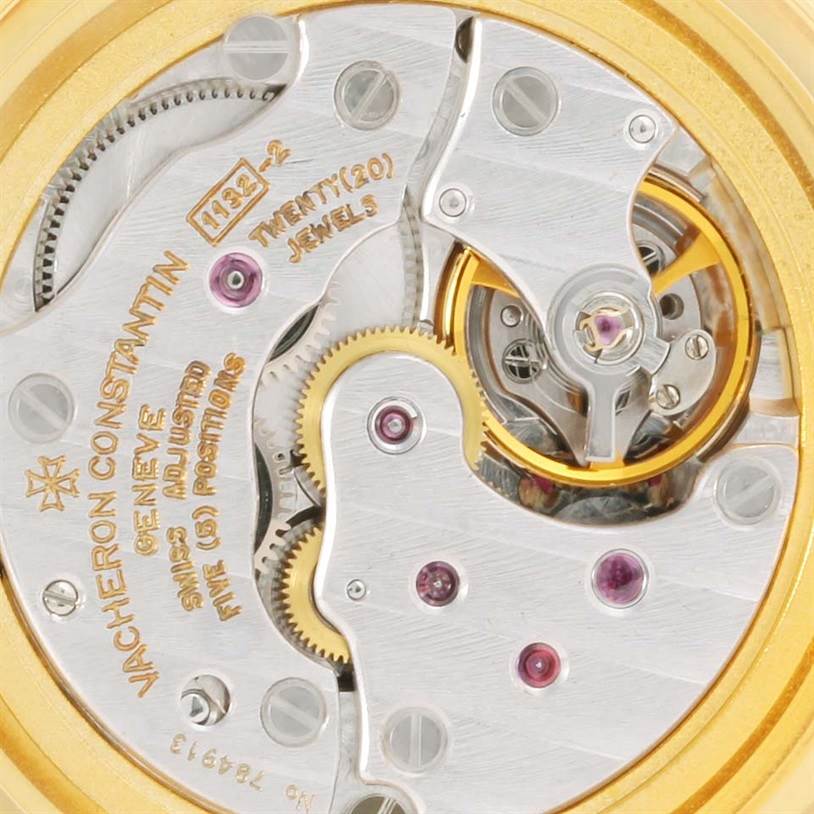This image shows a close-up of the movement mechanism of a vintage Vacheron Constantin watch, highlighting gears and jewel bearings.