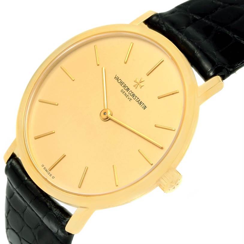 The image shows a close-up of a Vacheron Constantin Vintage 37039 Men's Yellow Gold Champagne Dial 37039 Men's Yellow Gold Champagne Dial watch face, including the dial, hands, and part of the black leather strap.
