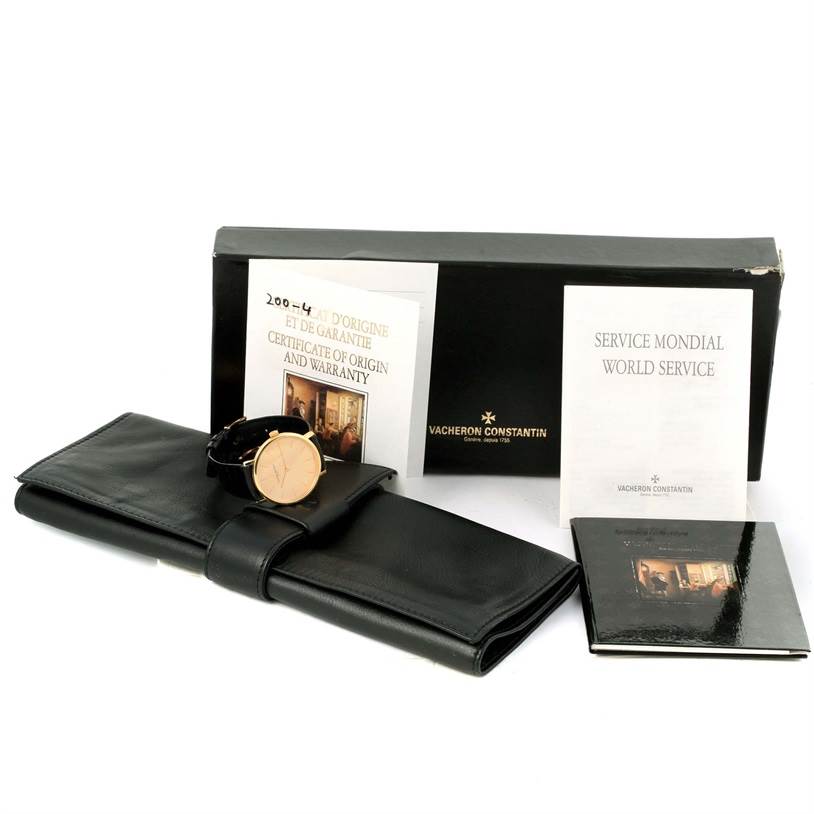 The image shows a Vintage Vacheron Constantin watch with its box, warranty certificates, service booklet, and leather watch case.