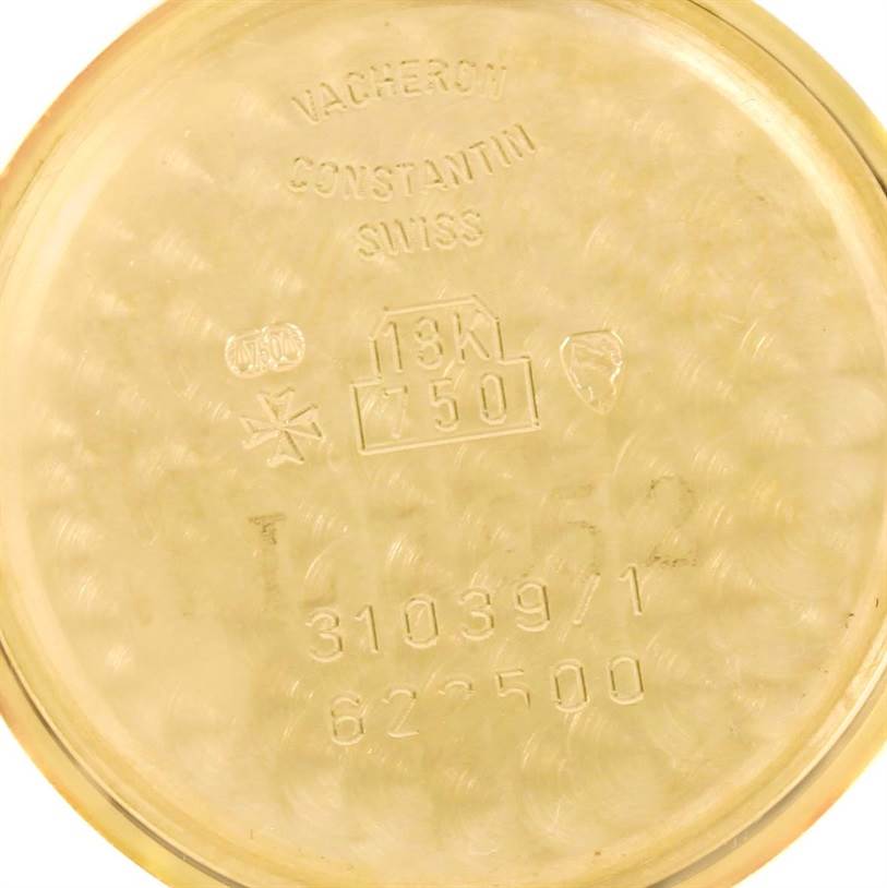 The image shows the inner case back of a Vintage Vacheron Constantin watch with engravings and hallmarks.