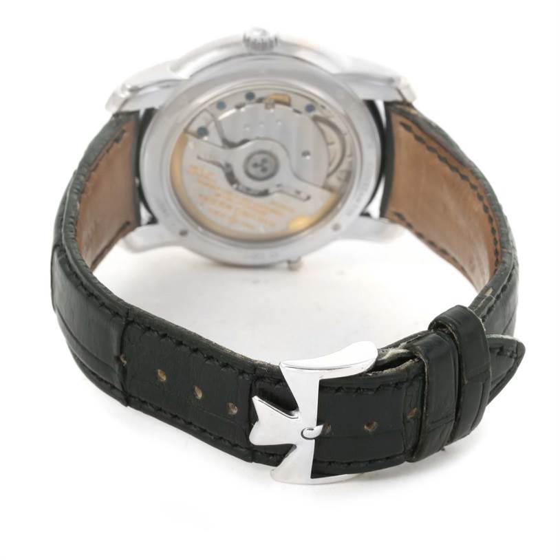 The image shows the backside of a Vacheron Constantin Patrimony 47245 Men's White Gold Beige Dial 47245 Men's White Gold Beige Dial watch, highlighting the movement and the leather strap with a distinctive clasp.