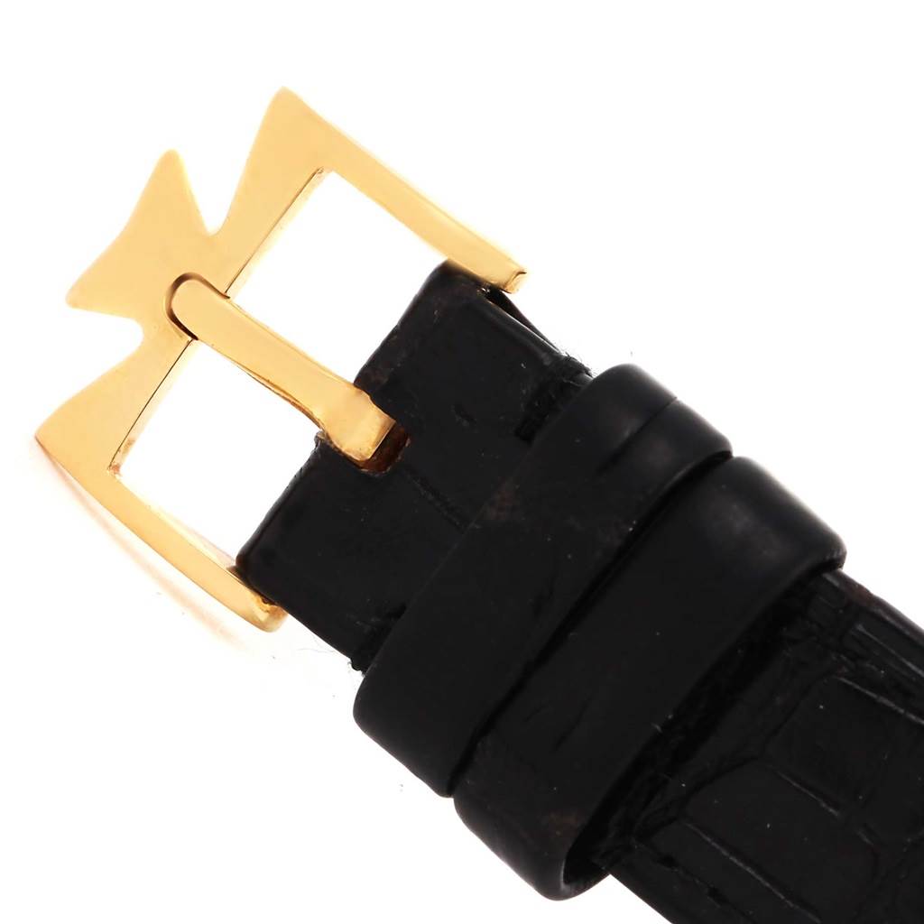 This image shows a close-up of the gold buckle and black leather strap of a Vacheron Constantin Historiques 47101/1 Men's Yellow Gold Silver Dial 47101/1 Men's Yellow Gold Silver Dial model watch.