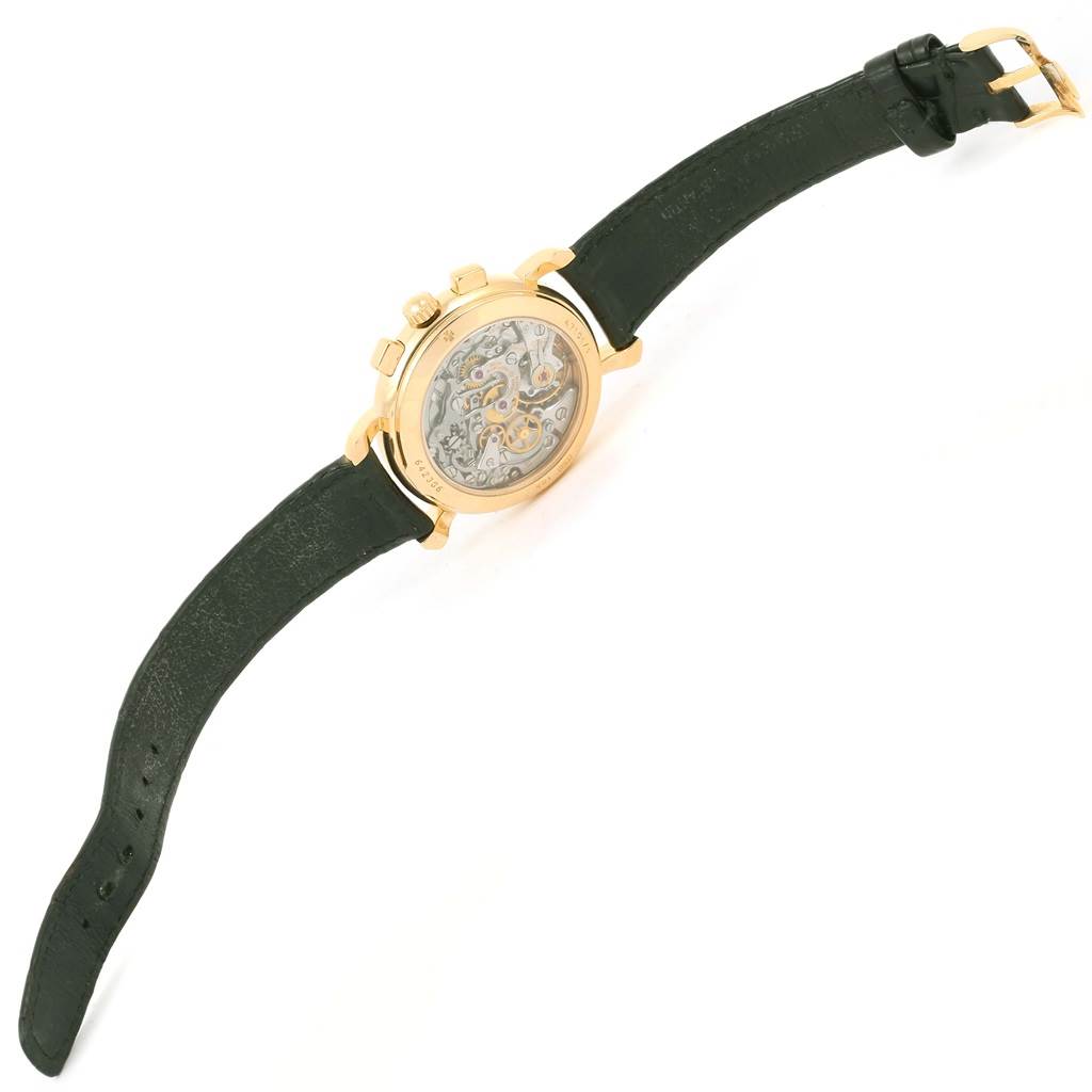 The image shows the back view of a Vacheron Constantin Historiques 47101/1 Men's Yellow Gold Silver Dial 47101/1 Men's Yellow Gold Silver Dial model watch, displaying its intricate movement and black leather strap.