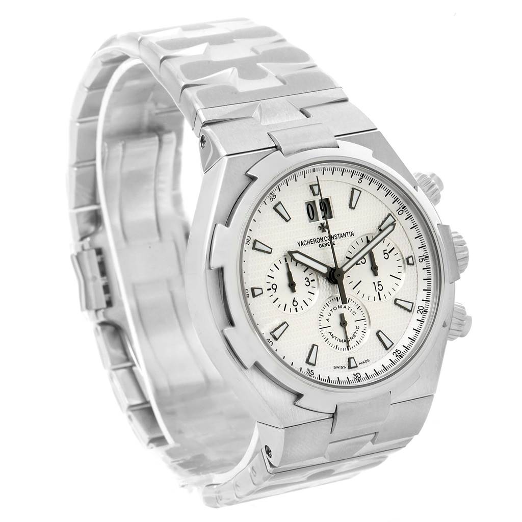 The image shows a Vacheron Constantin Overseas 49150 Men's Stainless Steel Silver Dial 49150 Men's Stainless Steel Silver Dial watch at a three-quarter angle, highlighting its dial, bezel, and part of the bracelet.