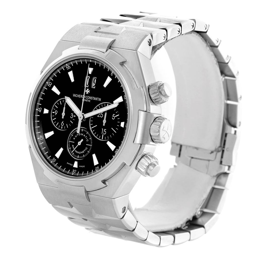 The image shows a Vacheron Constantin Overseas 49150.B01A.9097 Men's Stainless Steel Black Dial 49150.B01A.9097 Men's Stainless Steel Black Dial watch from a left three-quarter angle, highlighting the face, bezel, crown, and metal bracelet.