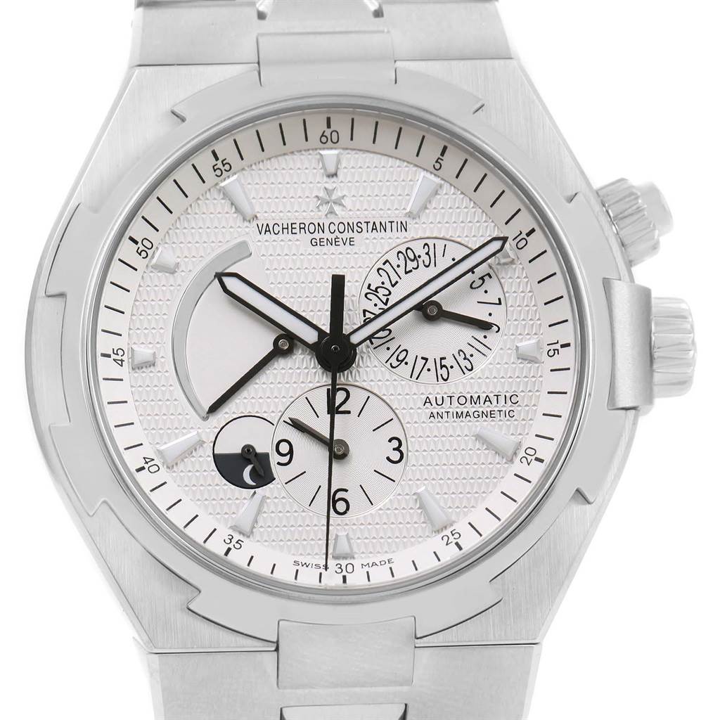 The image shows a close-up view of the dial and bezel of the Vacheron Constantin Overseas 47450/B01A-9226 Men's Stainless Steel Silver Dial 47450/B01A-9226 Men's Stainless Steel Silver Dial watch.